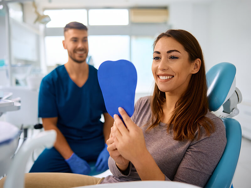 Dental specialist consulting with a patient